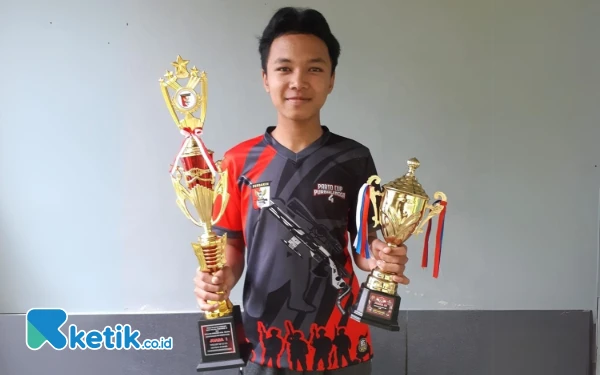 Thumbnail Fahmi Ramdhan, Shooter Asal Pacitan Raih Medali Emas Seleksi Popnas Jatim 2025